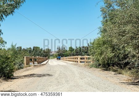 The Road Bridge Over A Flooded Orange River At Grootdrink In The Northern Cape Province. People Are 