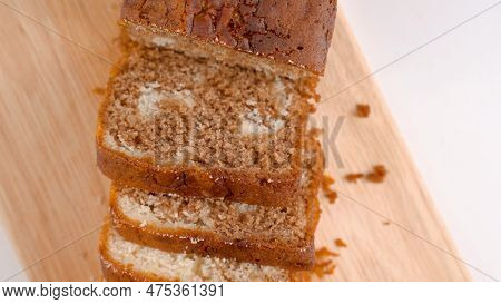 Close Up Of Sliced Brown Bread On Woood. High Quality Photo