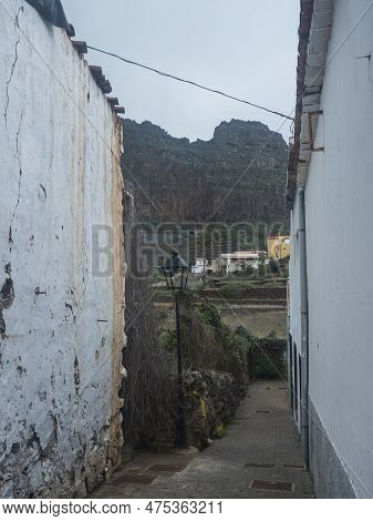 Narrow Street With Lamp And View Of Terraced Fields And Mountain In The Village Of Agulo Located In 