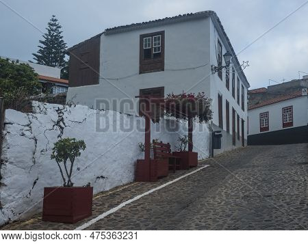 Cobbled Street With Colorful Traditional Houses In The Village Of Agulo Located In Green Valley At N
