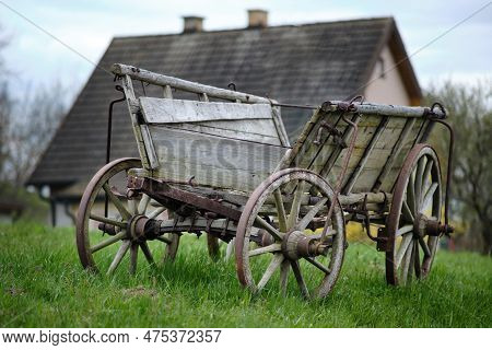 Old Vintage Rural Rusty Amish Timber Open Wagon. Horse/cow/ox-dragged Vehicle For Transporting Hey, 