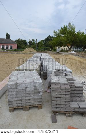 Paving Slabs, Tiles Piled In Pallets. Paving Slabs At Construction Site, Material For Restoration Of