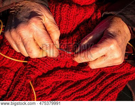 Hand Knitting With Woolen Thread With Knitting Needles Of Warm Clothes. Knitting Needles. Woolen Thr