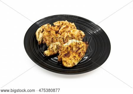 Barbaqued Chicken Breast On A Black Dinner Plate