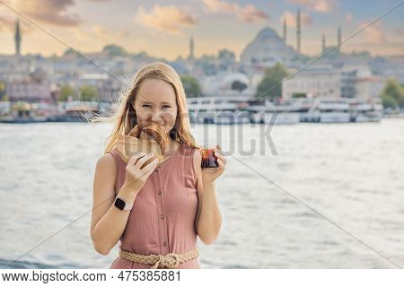 Woman In Istanbul Having Breakfast With Simit And A Glass Of Turkish Tea. Glass Of Turkish Tea And B