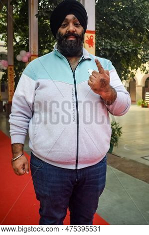 New Delhi, India - December 04 2022 - Unidentified People Showing Their Ink-marked Fingers After Cas