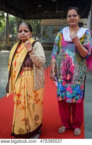 New Delhi, India - December 04 2022 - Unidentified People Showing Their Ink-marked Fingers After Cas
