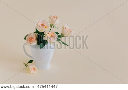 Tender Rose Flowers In A Vase On A Pink Pech Pastel Background. Place For Text.