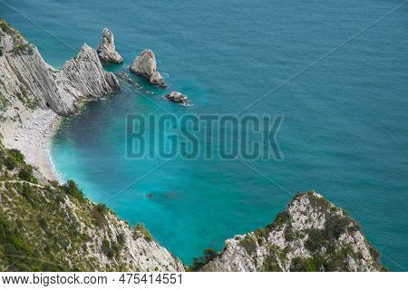Turquoise Water In The Famous Beach Of Two Sisters (spiaggia Delle Due Sorelle) In The Park Of Monte