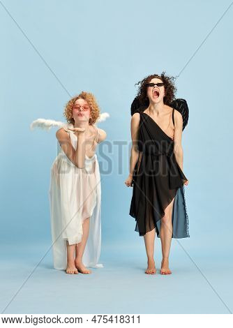 Kisses And Anger. Cte, Tender Girl In Image Of Angel And Emotional Shouting Woman In Image Of Devil 