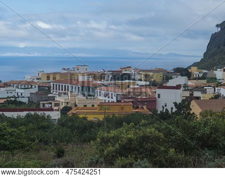 View Of Old Village Agulo With Colorful Traditional Houses, Terraced Fields And Ocean In Green Valle
