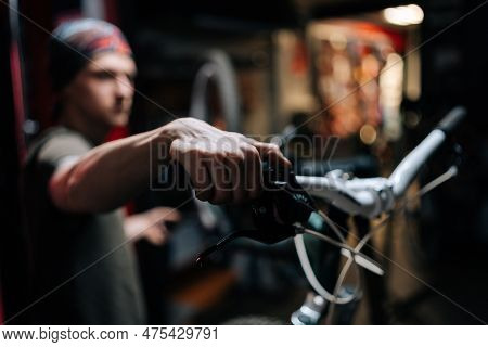 Close-up Hands Of Unrecognizable Mechanic Insisting Speed Switches On Mountain Bike Handlebar Workin