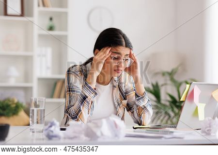 A Tired Young Indian Girl Gets Angry From The Number Of Tasks, Crumples Up The Paper And Throws It A