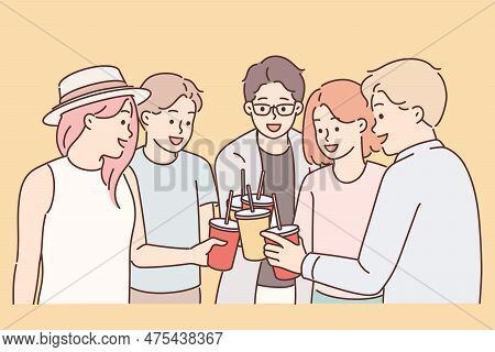 Group Of Young Guys And Girls Drink Drinks During Holiday Party From Disposable Cups With Straw. You