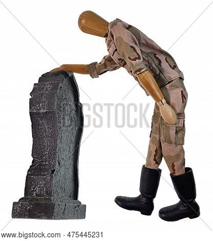 A Military Soldier Giving Prayer At A Gravestone