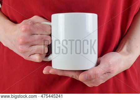 Closeup Of Woman's Hands Holding A Blank 11 Oz. White Coffee Mug. Her Red Blouse Adds Pizazz To The 