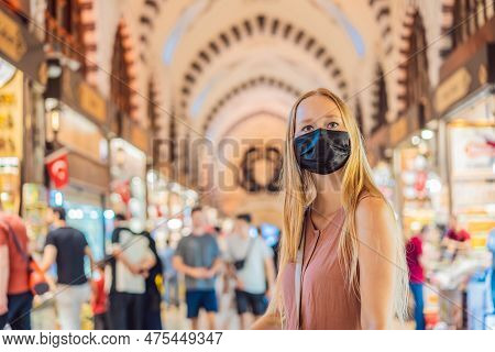 A Tourist Woman Walks Among The Countless Shops At The Grand Bazaar And Egyptian Bazaar In Istanbul.