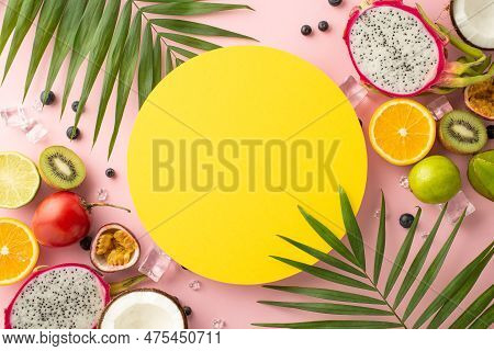 Tropical Oasis. A Beautiful Top View Flat Lay Of Exotic Fruits Dragon Fruit, Kiwi, Orange, Lime, Car