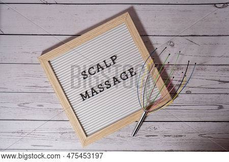 Scalp Massager For Home With Letter Board Scalp Massage Text. Close Up Of Scalp Massaging Brush For 