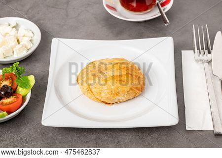 Izmir Boyoz On A White Porcelain Plate On A Stone Table
