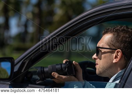 Paparazzi Men Or Guy In Sunglasse Sits In Her Car And Takes Pictures Of Famous Person.spy With Camer