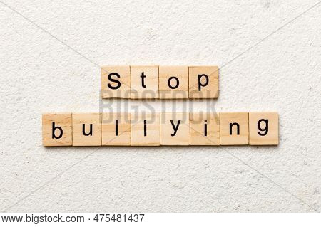 Stop Bullying Word Written On Wood Block. Stop Bullying Text On Cement Table For Your Desing, Concep