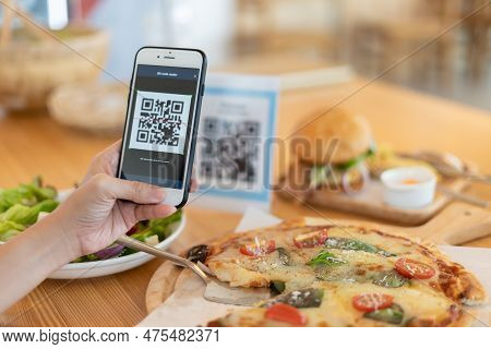 Woman Use Smartphone To Scan Qr Code To Pay In Cafe Restaurant With A Digital Payment Without Cash. 