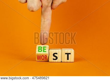 Best Or Worst Symbol. Businessman Turns Wooden Cubes And Changes The Word Best To Worst. Beautiful O