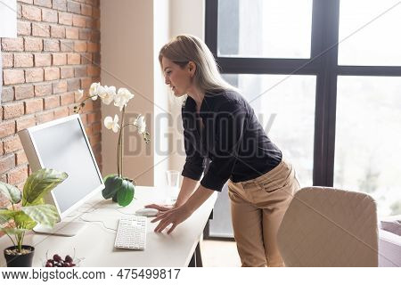 Successful Female Grapic Designer Watching Tutorial About Creative Ideas At Computer During Working 