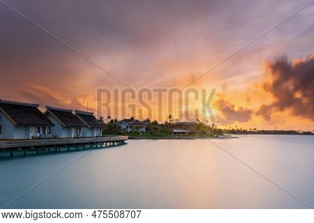 Sunset Over Sand Island Beach In Maldives. Crossroads Maldives, Saii Lagoon Hotel. Long Exposure Pic