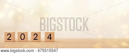 2024 On Wooden Table. 2024 New Year. Wooden Blocks 2024 On Neutral Grey Background. Start New Year 2