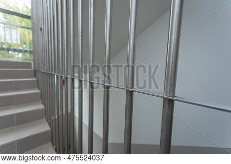 Protection Made Of Rods As An Infill Of The Balustrade On The Staircase.