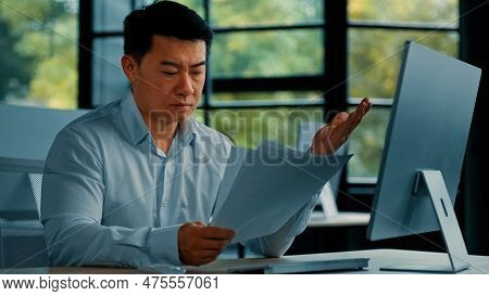 Desperate Sad Asian Japanese Senior Specialist Businessman Sit At Office Read Documents Scam Notific