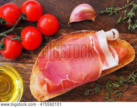 Spanish Appetizer. Toasted Bread Rubbed With Fresh Garlic White Ripe Tomato And Ham Then Drizzled Wi
