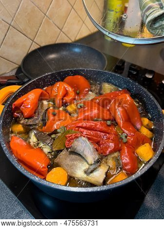 Colorful Fragrant Lecho Is Cooked In A Frying Pan On The Stove