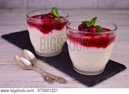 Two Servings Of Rice Pudding With Cherry Kuli.