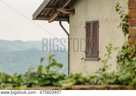 Panoramic View Of The Hills From An Old House With Wooden Roof And Window In San Sebastiano Da Po Ca