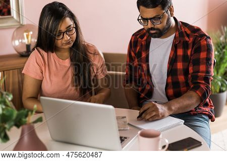 Serious Wife And Husband Planning Budget, Checking Finances, Focused Young Woman Using Online Calcul