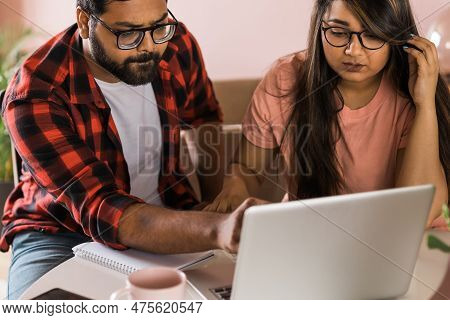 Serious Wife And Husband Planning Budget, Checking Finances, Focused Young Woman Using Online Calcul