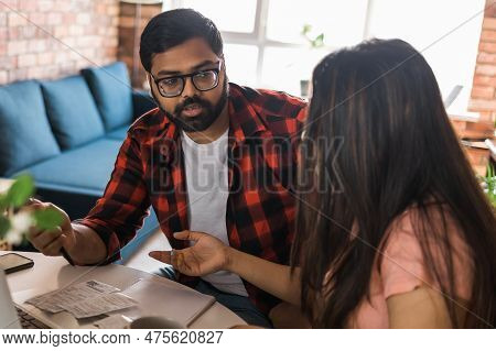 Serious Wife And Husband Planning Budget, Checking Finances, Focused Young Woman Using Online Calcul