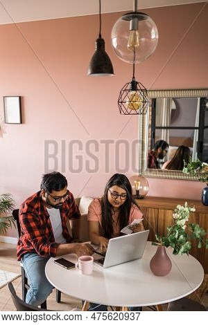 Serious Wife And Husband Planning Budget, Checking Finances, Focused Young Woman Using Online Calcul