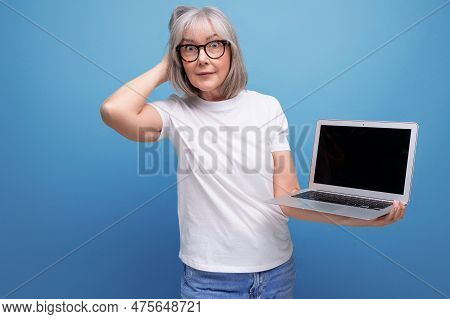 Middle Age Business. Middle Aged Woman With Gray Hair Re-learn Remote Profession Using Laptop On Stu