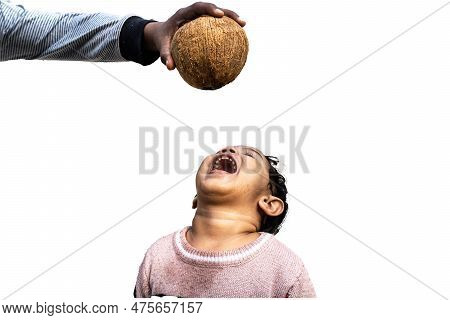 Asian Little Boy Child Drinks Coconut Water From A Fresh Coconut.