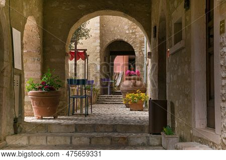 Castello Di Postignano, Italy - April 30, 2023: Archs In The Old Center Of Postignano With Colored C