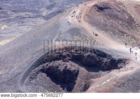 Mount Etna, Sicily, Italy - April 27, 2023: People Walking Above The Crater Silvestri On The Slope O