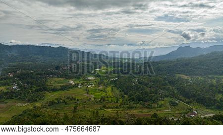 Farmland With Plantings And Mountains. Agricultural Landscape. Bukittinggi, Sumatra. Indonesia.