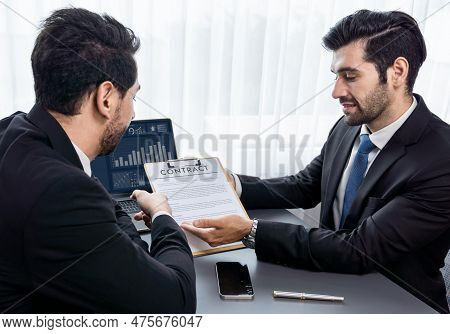 Interviewing Job Applicant In Office With Resume Paper. Candidate Wear Suit For Formal Conversation 