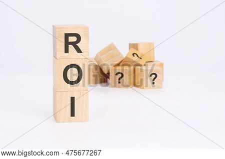 Roi - Return On Investment - Text On Wooden Cubes