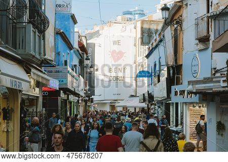 Benidorm, Spain - 01 April, 2023: People Walking And Enjoy Sunny Day On The Shopping Street In Benid