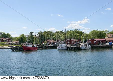 A Small Pier In Village During The Summer